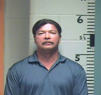 Charles Fourcloud, former finance director of the Passamaquoddy tribe’s Pleasant Point Reservation, in a police booking photo after police arrested him Sept. 23, 2013, in the tribal government parking lot for driving under a suspended California license.