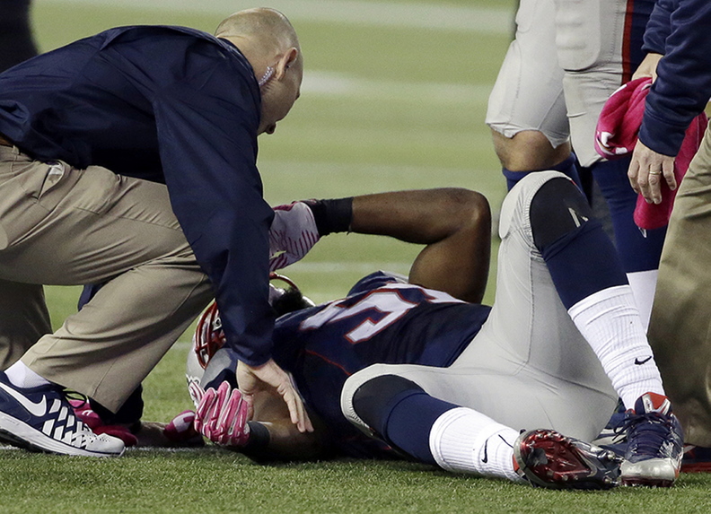 In this Oct. 13, 2013 photo, New England Patriots outside linebacker Jerod Mayo is tended after being injured on a tackle of New Orleans Saints running back Darren Sproles in the fourth quarter of an NFL football game in Foxborough, Mass. Mayo suffered a season-ending injury on the play, and the Patriots placed him on the injured reserve list on Wednesday, Oct. 16, 2013.