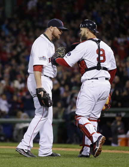 Boston Red Sox starting pitcher Jon Lester, left, and catcher David Ross react following a double play during the fourth inning of Game 1 of baseball's World Series against the St. Louis Cardinals Wednesday, Oct. 23, 2013, in Boston. (AP Photo/Matt Slocum)