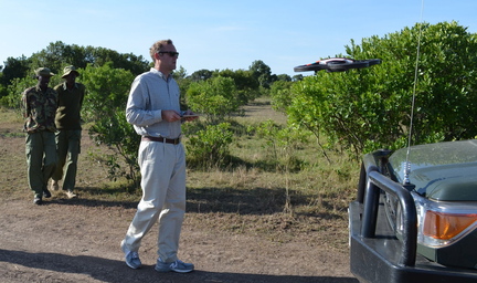 Marc Goss operates a drone near the Maasai Mara National Reserve in Kenya. The drone, intended to provide aerial footage and track poachers, proved useful for herding elephants.