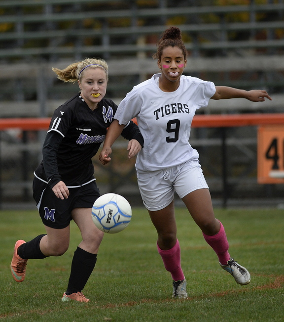 Hannah Folger of Marshwood, left, and Shaina Speight of Biddeford compete for a loose ball in their SMAA game.