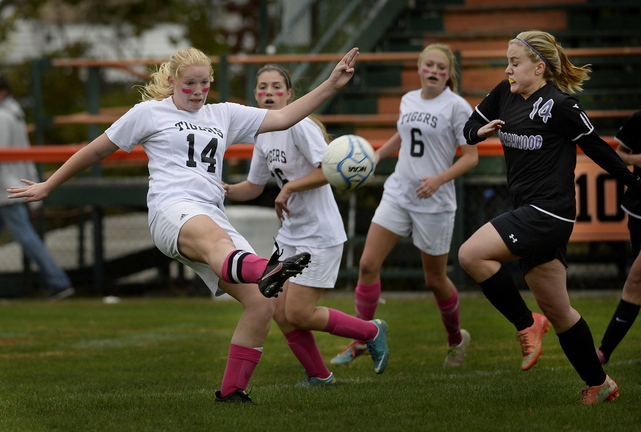 Ryanne Desjardins of Biddeford kicks the ball down the field as Hannah Folger of Marshwood moves in Wednesday during Biddeford’s 3-1 victory at home.
