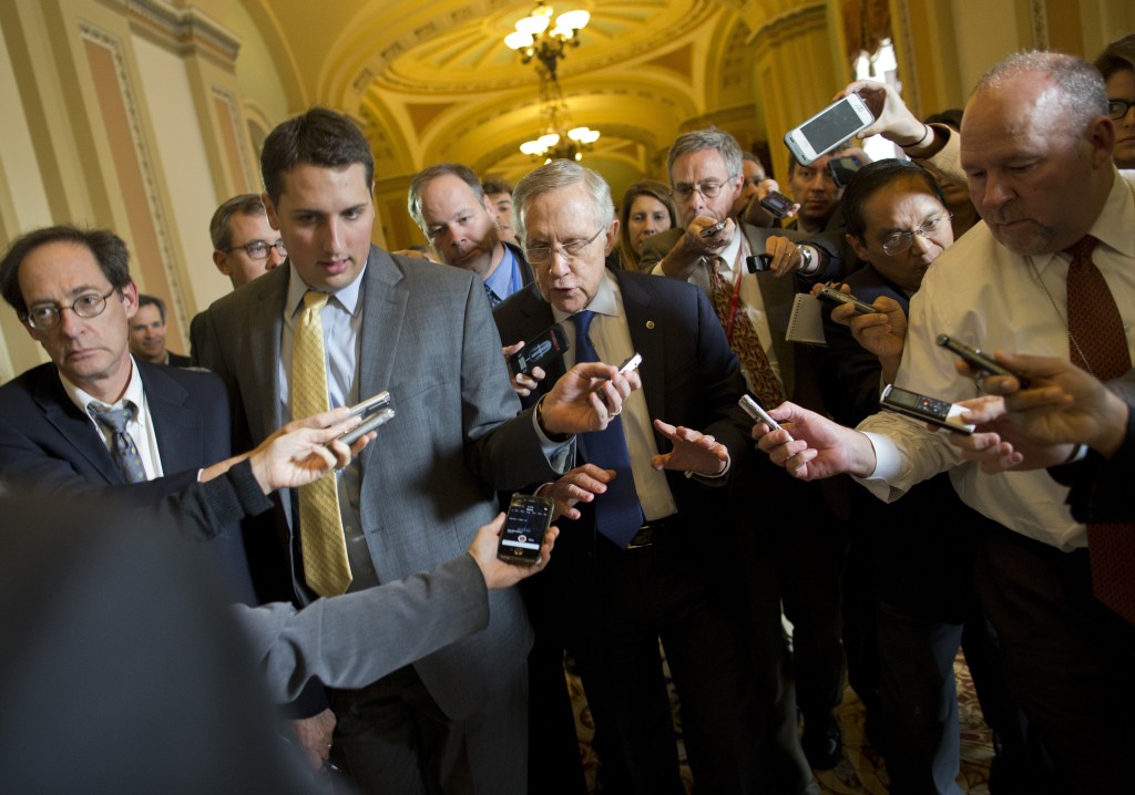 Senate Majority Leader Sen. Harry Reid, D-Nev., is surrounded by reporters after leaving the office of Senate Minority Leader Sen. Mitch McConnell, R-Ken., on Capitol Hill on Monday in Washington. “We’re getting closer,” Reid told reporters.