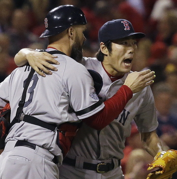 Red Sox closer Koji Uehara hugs catcher David Ross after closing out the Cardinals in the ninth inning Monday night. Ross broke a 1-1 tie with an RBI double in the seventh inning, helping Boston to a 3-1 win. The Sox are home Wednesday night with a chance to celebrate.
