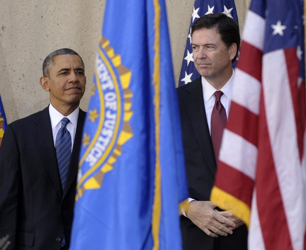 President Obama stands with James Comey at Comey’s installation as FBI director Monday at FBI Headquarters in Washington. Comey took over for Robert Mueller, who stepped down after 12 years as agency director.