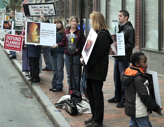 Opponents of abortion protest outside the Planned Parenthood clinic on Congress Street in Portland in an Oct. 19, 2012, file photo. The First Amendment gives demonstrators the right to protest abortion, but it doesn’t give them the right to insert themselves into that private matter on an individual level.