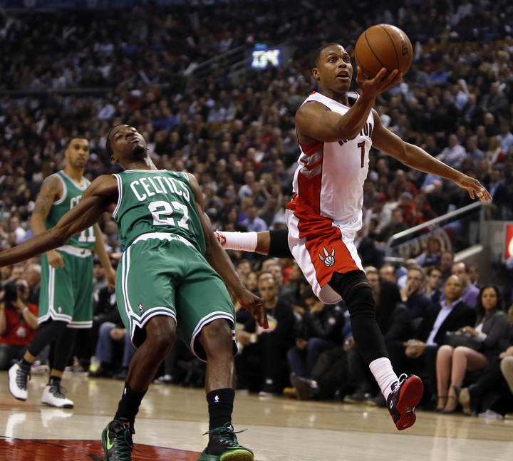Kyle Lowry drives to the net past Boston guard Jordan Crawford during the Raptors’ 93-97 win Wednesday in Toronto.