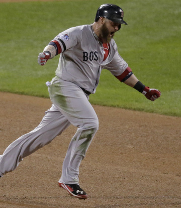 Jonny Gomes celebrates after hitting a tiebreaking three-run homer in the sixth inning Sunday night, lifting the Red Sox to a 4-2 win over the Cardinals in Game 4 of the World Series.