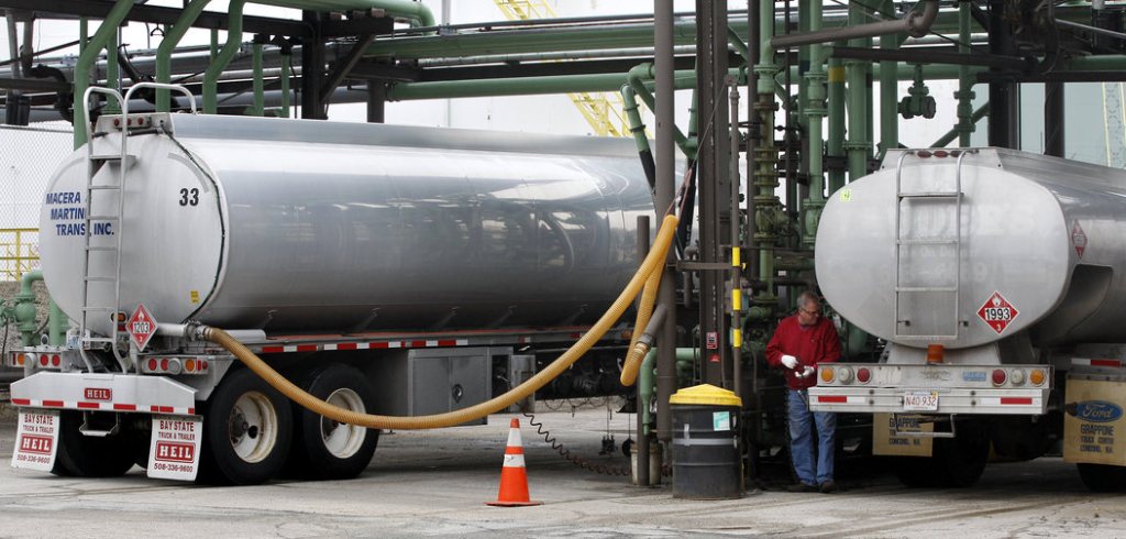 An oilman prepares to fill his truck with home heating fuel at a depot in Quincy, Mass., in 2011. Most Americans will pay more to heat their homes this winter, according to government forecasts out this week.