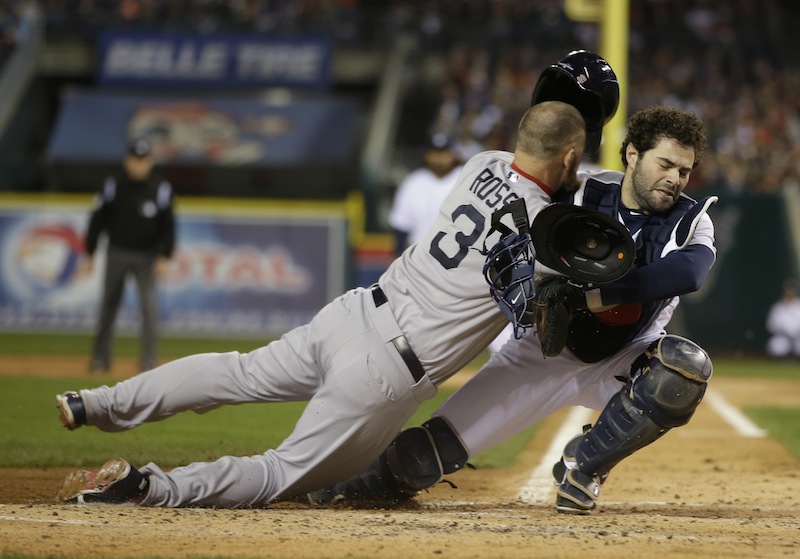 Boston Red Sox's David Ross is out at home on a fielder choice collides with Detroit Tigers catcher Alex Avila in the second inning during Game 5 of the American League baseball championship series Thursday, Oct. 17, 2013, in Detroit.