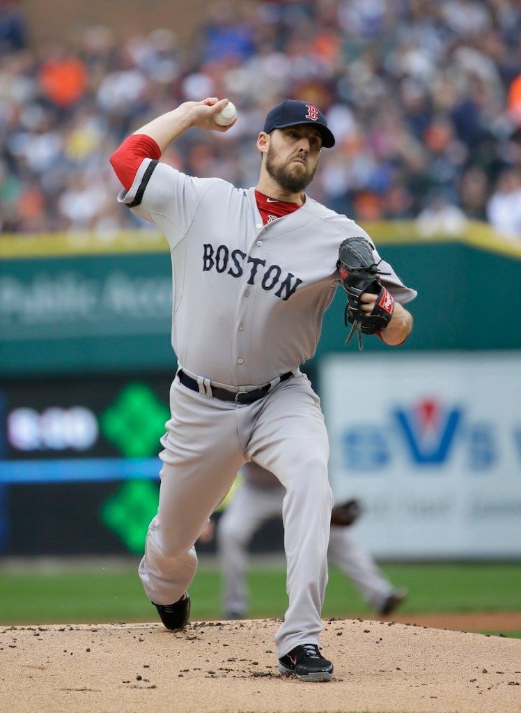 Red Sox starting pitcher John Lackey throws in the first inning during Game 3 of the American League baseball championship series Tuesday.