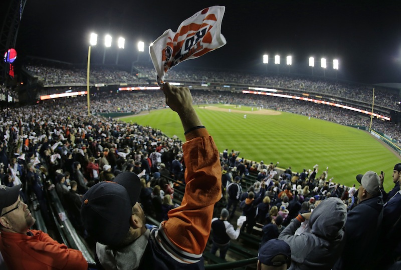 A Detroit Tigers fan cheers before the start of Game 5 of the American League baseball championship series against the Boston Red Sox, Thursday, Oct. 17, 2013, in Detroit.