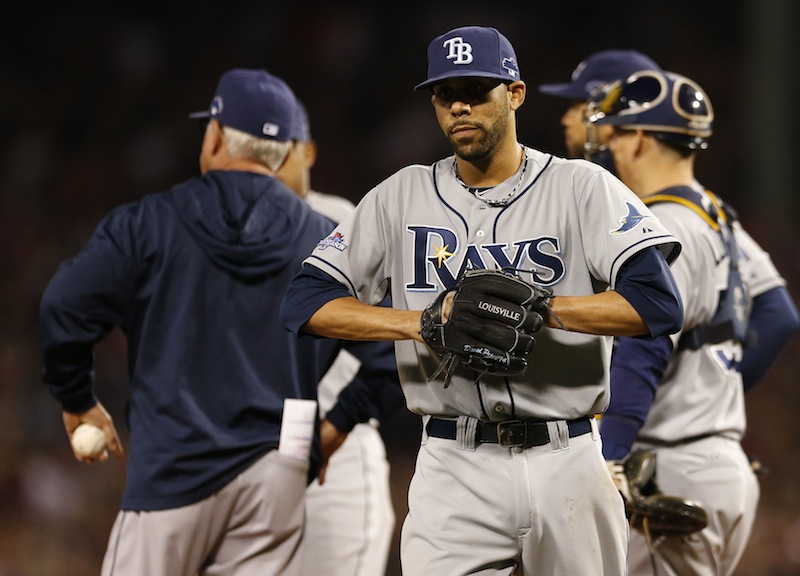 Tampa Bay Rays manager Joe Maddon, left, holds the ball as starting pitcher David Price leaves the baseball game in the top of the eighth inning in Game 2 of the Rays' American League division series against the Boston Red Sox Saturday, Oct. 5, 2013, in Boston. (AP Photo/Michael Dwyer) MLB