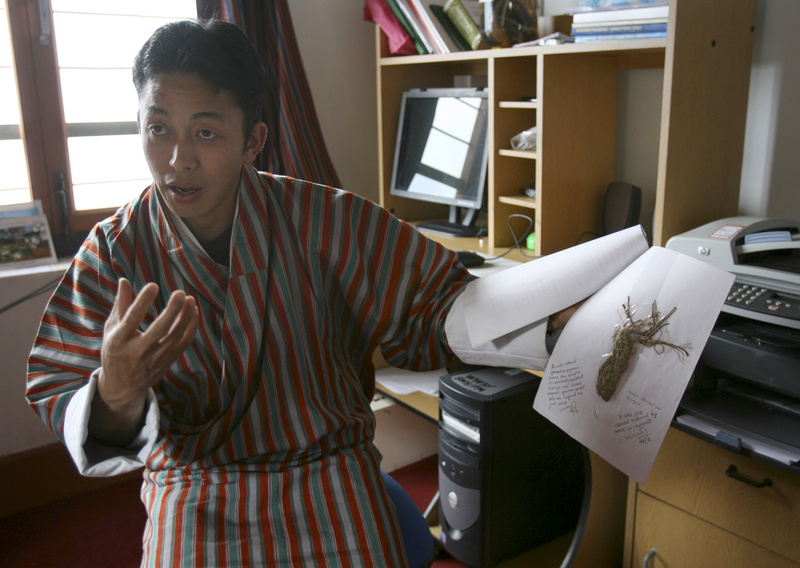 The manager of Sakteng Wildlife Sanctuary, Tenzing Wangchuck, shows a specimen collected from the park by Yeti watchers at Phongme, Bhutan. A hair sample from Bhutan was one of two analyzed by a British scientist who developed a theory about Yetis.