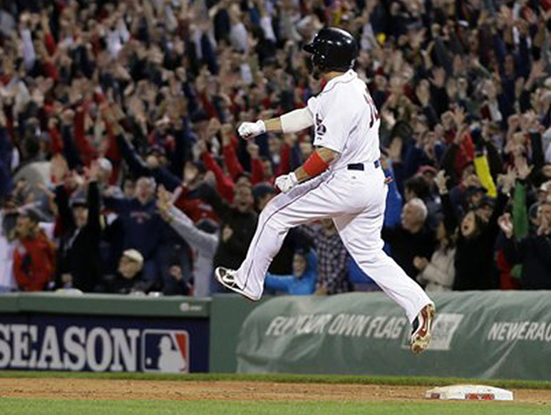 Red Sox right fielder Shane Victorino celebrates his grand slam against the Detroit Tigers as he rounds first base in the seventh inning of Game 6 of the American League Championship Series on Saturday at Fenway Park.