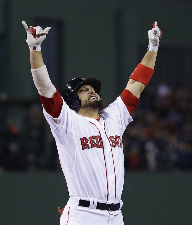 Boston Red Sox right fielder Shane Victorino celebrates after hitting a three run RBI double during the third inning of Game 6 of baseball's World Series against the St. Louis Cardinals Wednesday, Oct. 30, 2013, in Boston. MLB