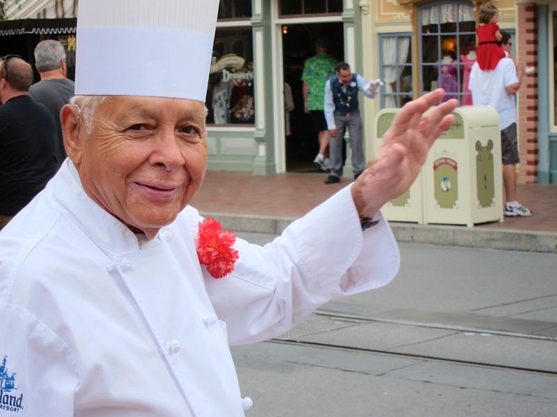 Oscar Martinez, 77, greets diners at the Carnation Cafe at Disneyland in Anaheim, Calif. The chef is the park's longest-tenured employee, beginning as a busboy nearly 57 years ago. He says he loves his job, and a new poll from the Associated Press-NORC Center for Public Affairs finds he's not alone: Nine out of ten workers 50 and older say they're satisfied with their work.