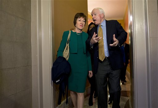 Sen. John McCain, R-Ariz., talks with Sen. Susan Collins, R-Maine, on Capitol Hill in in 2014. 