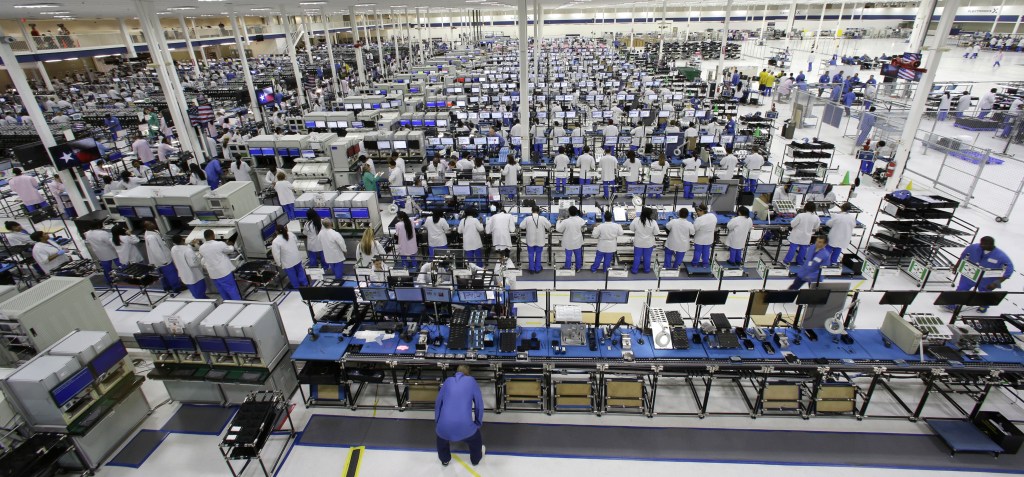 Employees work at the Motorola smartphone plant in Fort Worth, Texas, last month. The plant is the only U.S. factory making mobile phones.