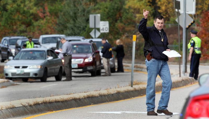 With the help of state and local police, FBI agents set up a road block to question drivers Wednesday, Oct. 16, 2013, in North Conway, N.H., The road is where 15-year-old Abigail Hernandez would have walked home from school. Its been a week since the teenager was last seen leaving school.
