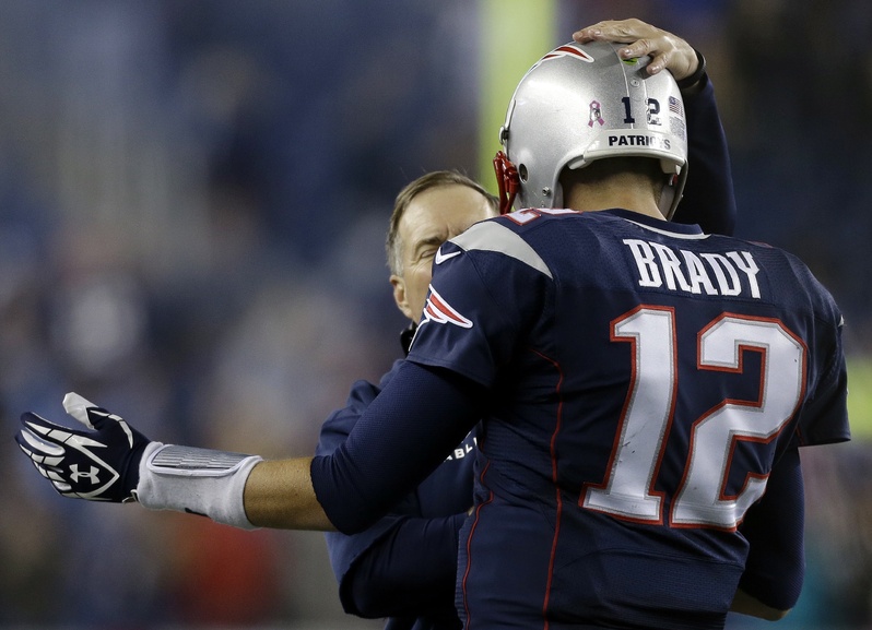 New England Patriots head coach Bill Belichick congratulates quarterback Tom Brady on his winning touchdown pass against the New Orleans Saints in the fourth quarter of an NFL football game Sunday in Foxborough, Mass. The Patriots won 30-27. NFLACTION13;