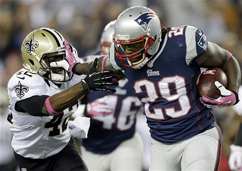New England Patriots running back LeGarrette Blount (29) stiff-arms New Orleans Saints free safety Isa Abdul-Quddus (42) as he runs for yardage in the third quarter Sunday in Foxborough, Mass. NFLACTION13;