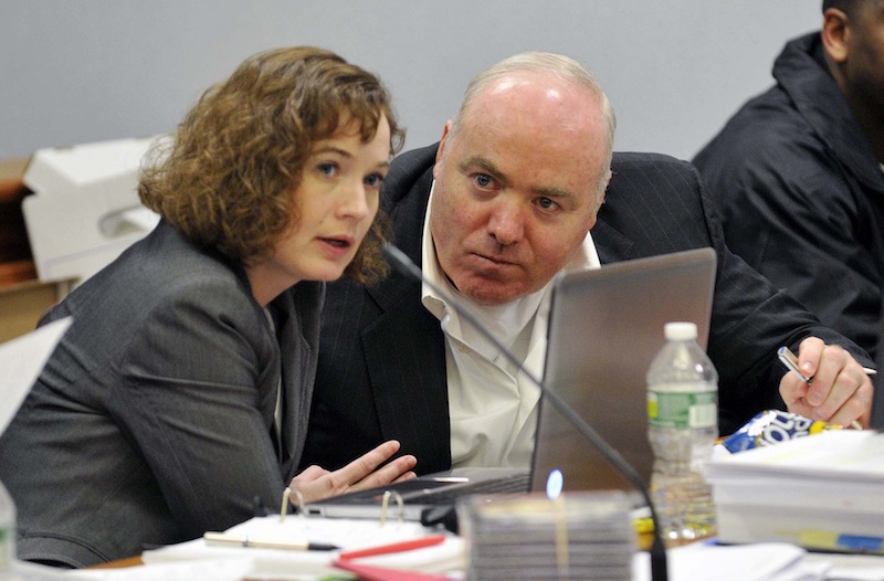 Michael Skakel, right, talks to Jessica Santos, one of his defense attorneys, in April during his appeal at state Superior Court in Vernon, Conn.