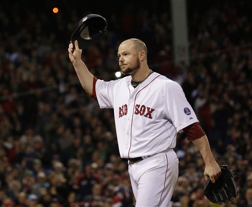 Boston Red Sox starting pitcher Jon Lester acknowledges the crowd as he leaves the game during the eighth inning of Game 1 of the World Series against the St. Louis Cardinals Wednesday in Boston.