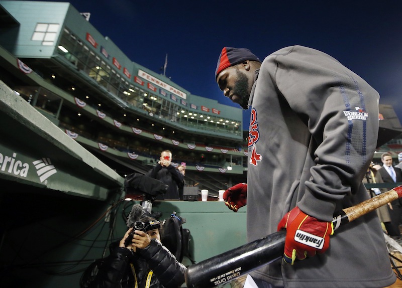 Boston Red Sox designated hitter David Ortiz walks into the dugout after a workout at Fenway Park in Boston, Tuesday, Oct. 29, 2013. The Red Sox are scheduled to host the St. Louis Cardinals in Game 6 of baseball's World Series on Wednesday.