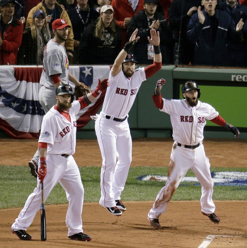 St. Louis Cardinals starting pitcher Adam Wainwright, left, rear watches as Boston Red Sox's Jonny Gomes, left, Jacoby Ellsbury, center, and Dustin Pedroia, celebrate a three-run scoring double by Mike Napoli during the first inning of Game 1 of baseball's World Series Wednesday, Oct. 23, 2013, in Boston. MLB