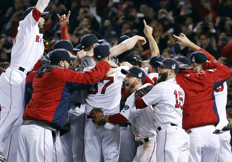 Boston Red Sox players celebrate on the field after they defeated the St. Louis Cardinals 6-1 in Game 6 of baseball's World Series on Wednesday at Fenway Park in Boston.