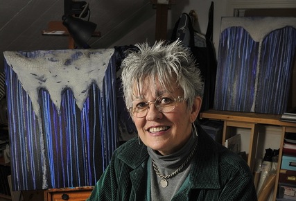 Artist Pamala Crabb of Springvale will show her multimedia abstracts in an exhibition called “Alzheimer Forgets,” inspired by her personal feelings about her father’s illness. Crabb is shown in the studio she created in her home.