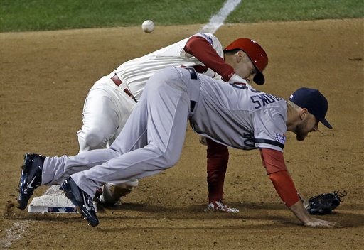 St. Louis Cardinals' Allen Craig gets tangled with Boston Red Sox's Will Middlebrooks during the ninth inning of Game 3 of baseball's World Series Saturday, Oct. 26, 2013, in St. Louis. Middlebrooks was called for obstruction on the play and Craig went in to score the game-winning run. The Cardinals won 5-4 to take a 2-1 lead in the series. (AP Photo/David J. Phillip) MLB