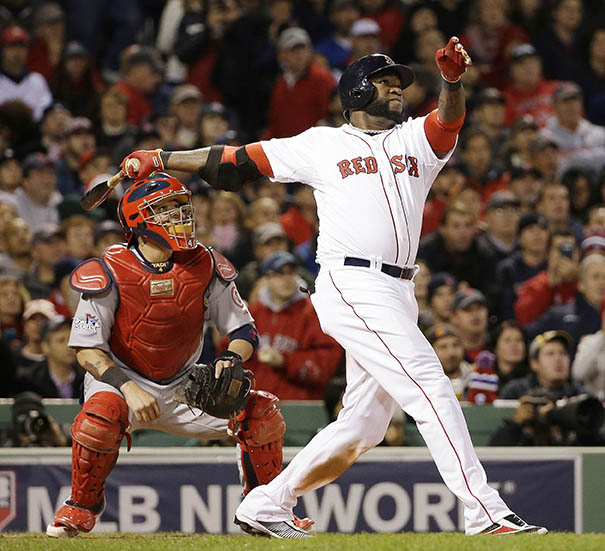 Cardinals catcher Yadier Molina watches as Boston's David Ortiz hits a two-run home run during the seventh inning of Game 1 of the World Series Wednesday in Boston.