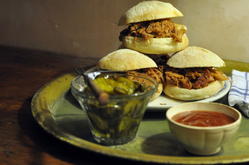Pulled-pork sliders with sweet jalapeno-spiked pickles should keep football watchers pleasantly filled for even extra-long games.