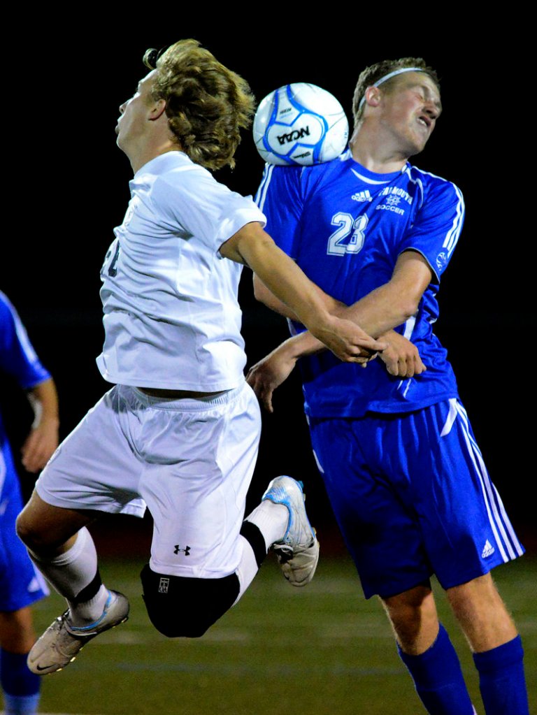 Yarmouth’s Wyatt Jackson, left, and Falmouth’s Nick Burton battle for a head ball during Yarmouth’s 1-0 win at home on Monday night. Yarmouth improved to 6-0-2 with the win, while Falmouth fell to 3-2-2.