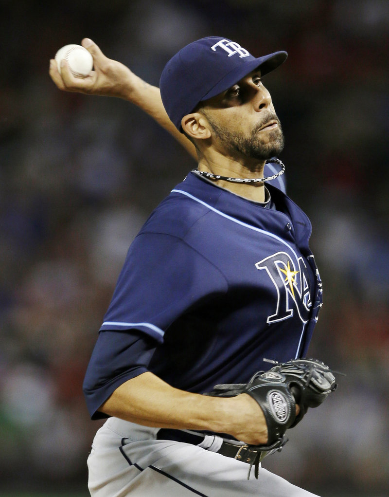 David Price improved to 10-8, throwing his fourth complete game of the season while allowing just seven hits in a 5-2 win Arlington, Texas.