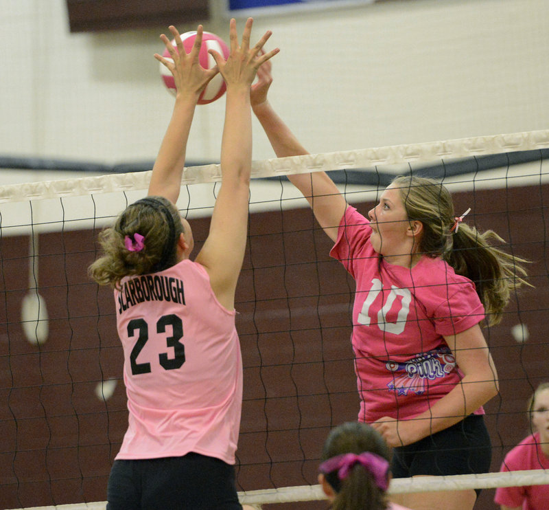 Mary Cleary of Scarborough has her hands in position to knock away a shot by Lauren Weickert of Greely.