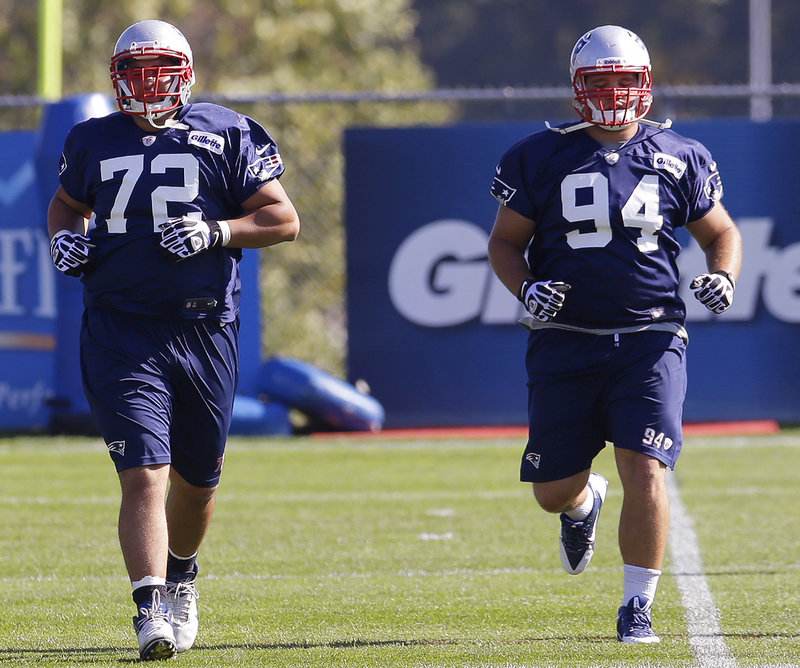 Rookie defensive tackles Joe Vellano, left, and Chris Jones will get the first crack at trying to fill in for the injured Vince Wilfork for the New England Patriots.
