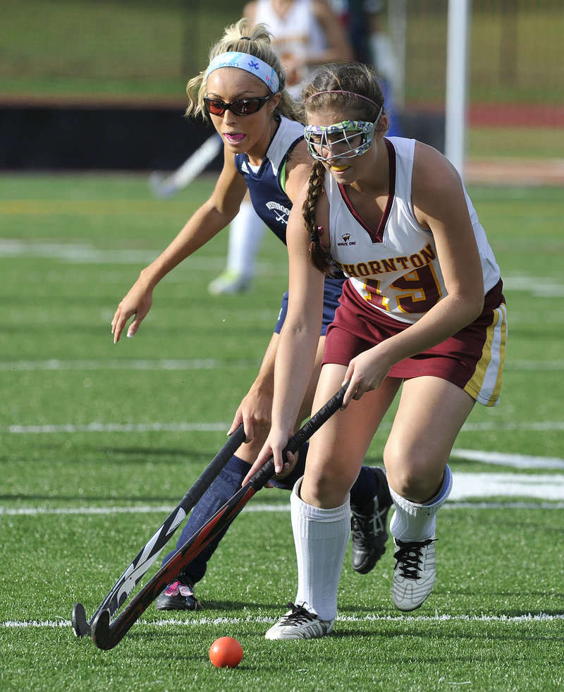 Francesca Petrucci of Thornton Academy moves the ball upfield while pursued by Siobhan Foley of Westbrook.