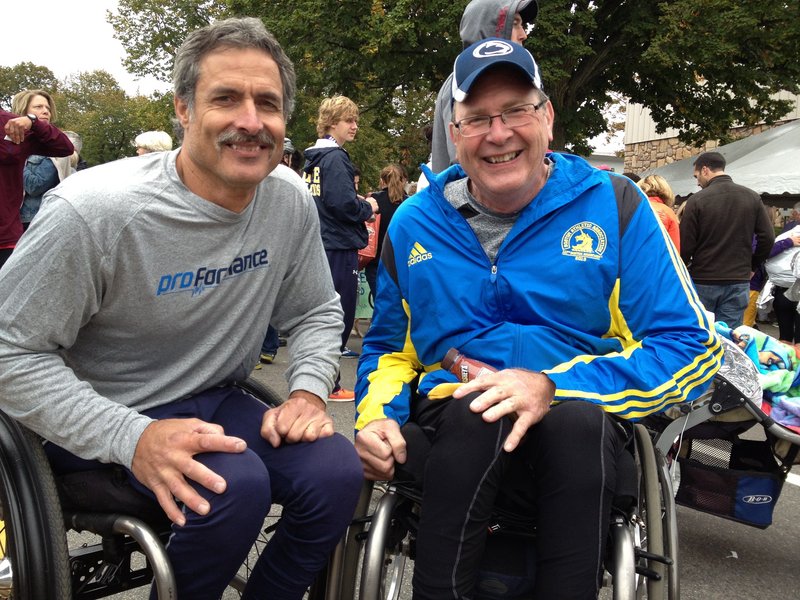 Wheelchair winner Grant Berthiaume, left, of Tucson, Ariz., shares a post-race moment with Paul Erway of Shelbyville, Ky., who finished third. They and runner-up Aaron Roux of Tucson are on a quest to complete 50 wheelchair marathons in 50 states in 50 weeks. Maine was No. 36. Berthiaume won in 2:19:57. Next weekend: Baltimore on Saturday and Chicago on Sunday.
