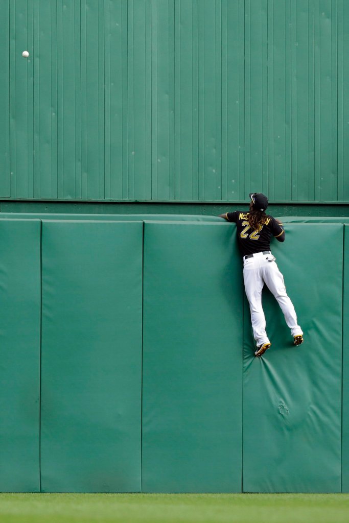 Center fielder Andrew McCutchen watches in vain as Matt Holliday’s two-run homer provides the St. Louis Cardinals with all the offense they needed to nip Pittsburgh.