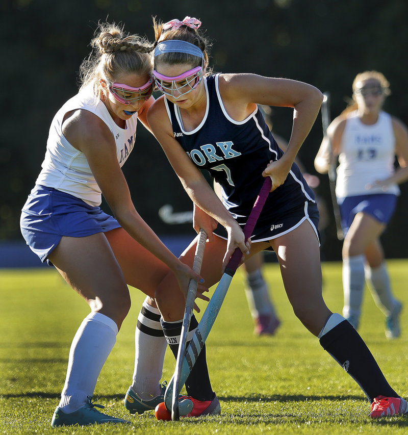 Taylor Simpson of York, right, was pursued by colleges in all three divisions before she decided on Merrimack, a national Division II field hockey power.