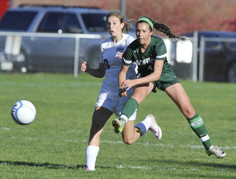 Helen Gray-Bauer of Waynflete, right, gets off a pass Tuesday ahead of Brooke Heathco of Freeport during their Western Maine Conference game. Waynflete reached 7-1-1 with a 2-0 victory. Freeport is 7-4.