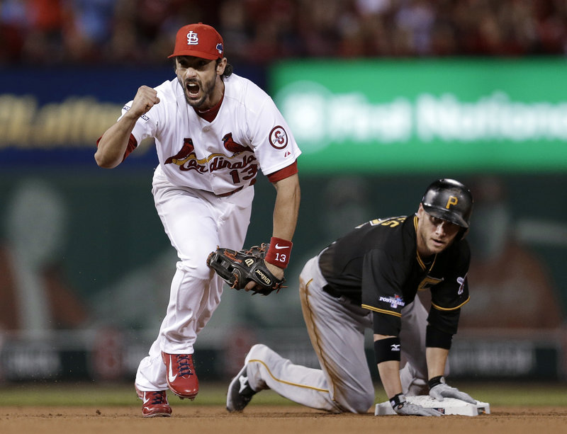 Second baseman Matt Carpenter of the St. Louis Cardinals celebrates Wednesday night after forcing Clint Barmes, then completing a double play. The Cards beat the Pirates, 6-1.