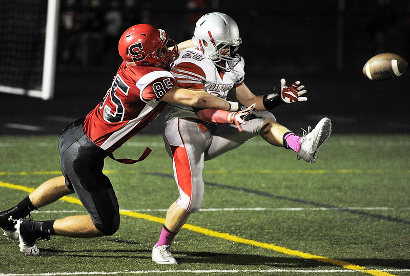 Chris Cyr of Scarborough prevents Joey DiBiase of South Portland from hauling in what would have been a touchdown reception.