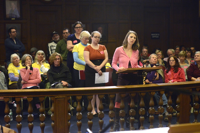As Amanda Boger of Portland speaks, members of the public wait their turn to address the City Council during a hearing Monday evening on a proposed buffer zone around Planned Parenthood.