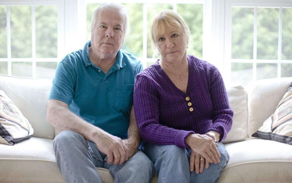 Dean and Mary Lou Griffin sit their home in Chadds Ford, Pa., on Friday. They are among millions nationwide who are receiving notices that their health insurance policies are being discontinued because they don’t meet the higher benefit standards of the new law.