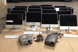 This photo furnished by the Portland Police Department shows Apple desktop computers recovered by police after a burglary at Hall Elementary School early Friday morning.