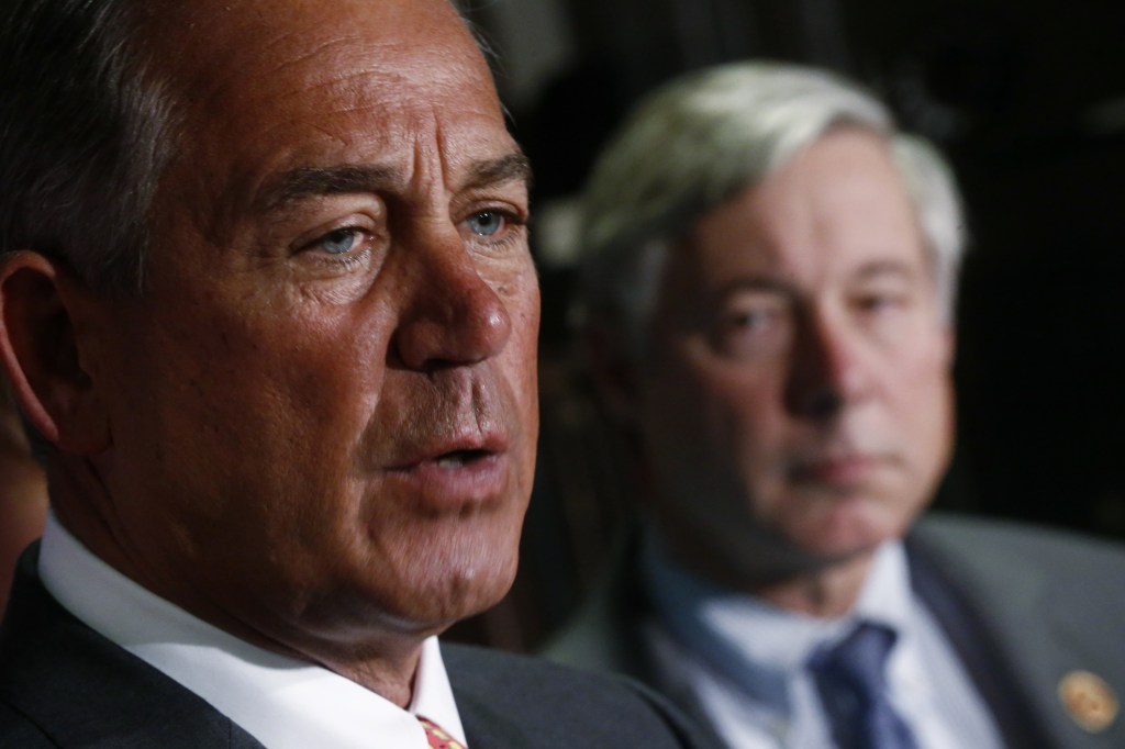 House Speaker John Boehner of Ohio, left, speaks about President Obama’s health care law Wednesday. Looking on is Rep. Fred Upton, R-Mich., who has proposed a bill that would allow insurers to keep selling insurance that doesn’t offer the type of benefits required by Obama’s health care law.